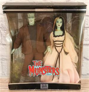 The Munster's Barbie Giftset: The Munster's Barbie Giftset. Dolls are in new condition inside heavily damaged box. All invoices must be paid for within 24